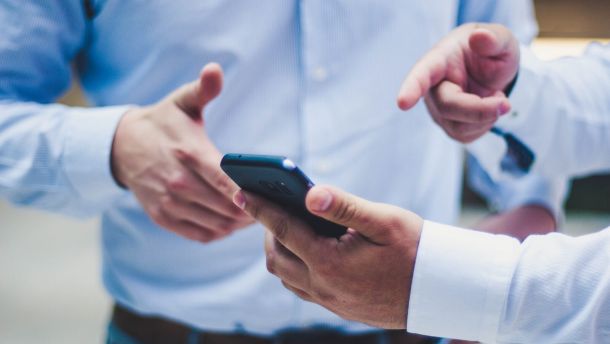 person holding black smartphone