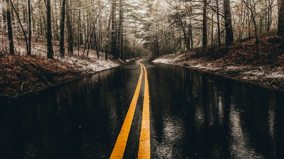 landscape photo of asphalt road while raining