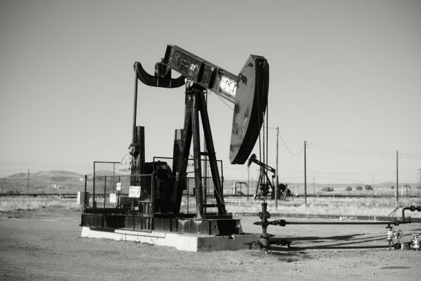 a black and white photo of an oil pump
