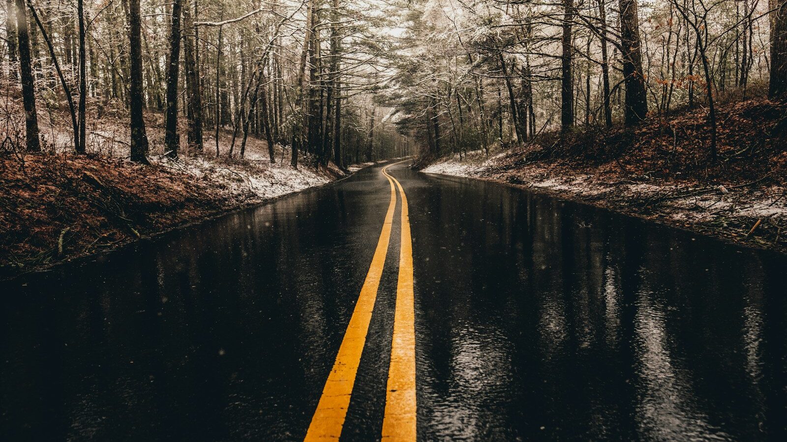 landscape photo of asphalt road while raining