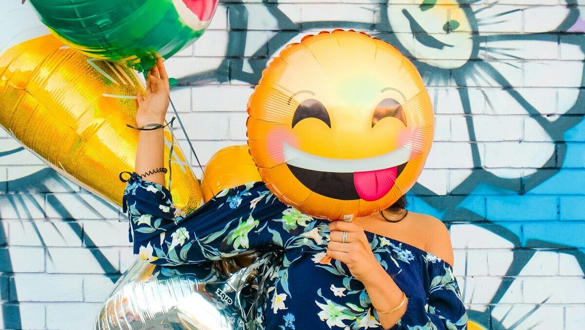 woman holding balloons