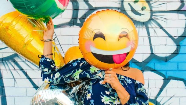 woman holding balloons