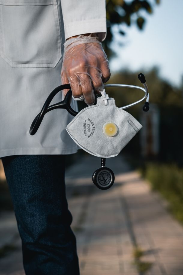 doctor with stetoscope mask and gloves down
