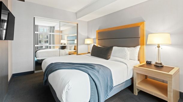 white bed linen on bed